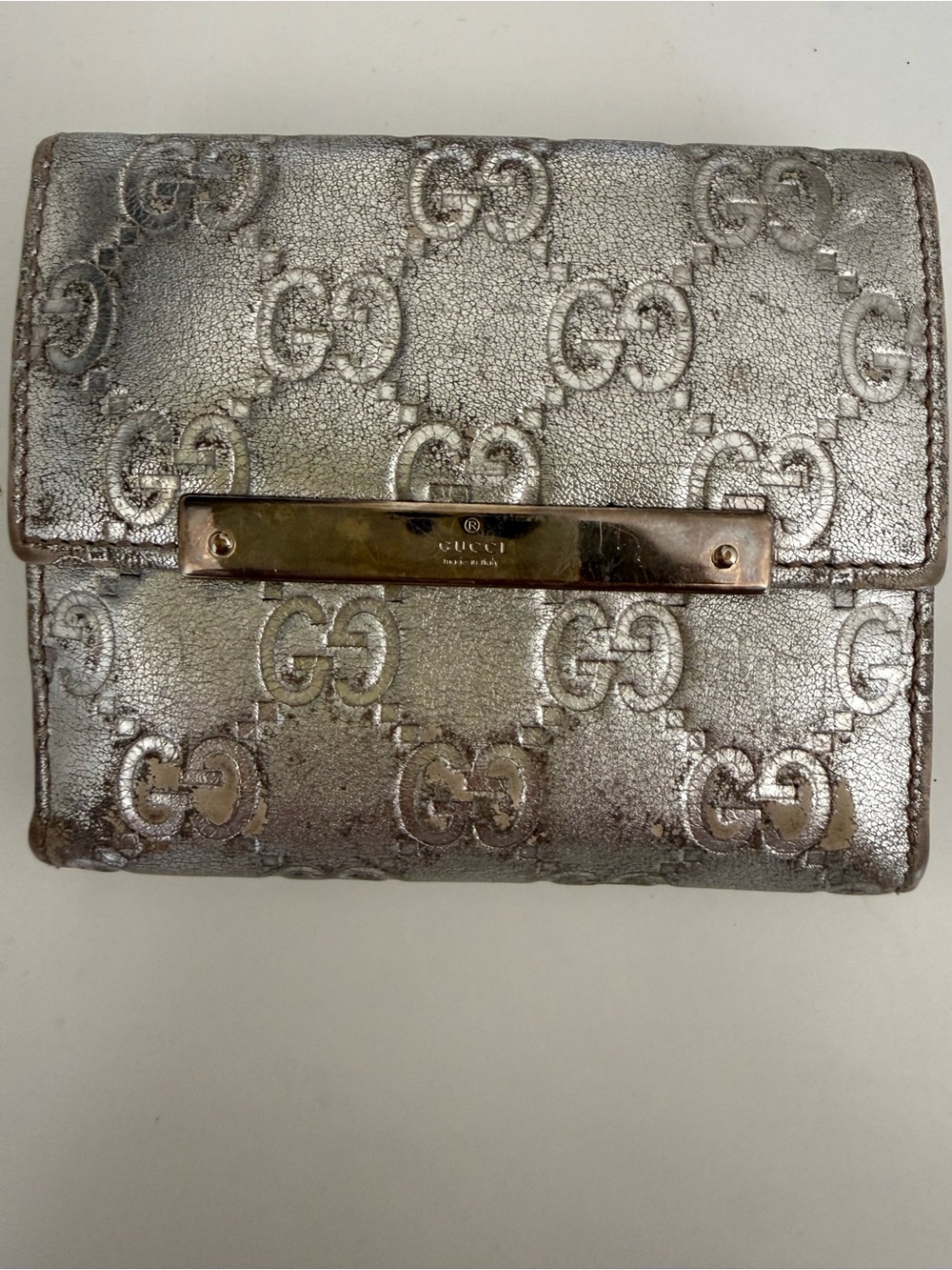 Gucci Silver Metallic Embossed GG Wallet with Gold Nameplate